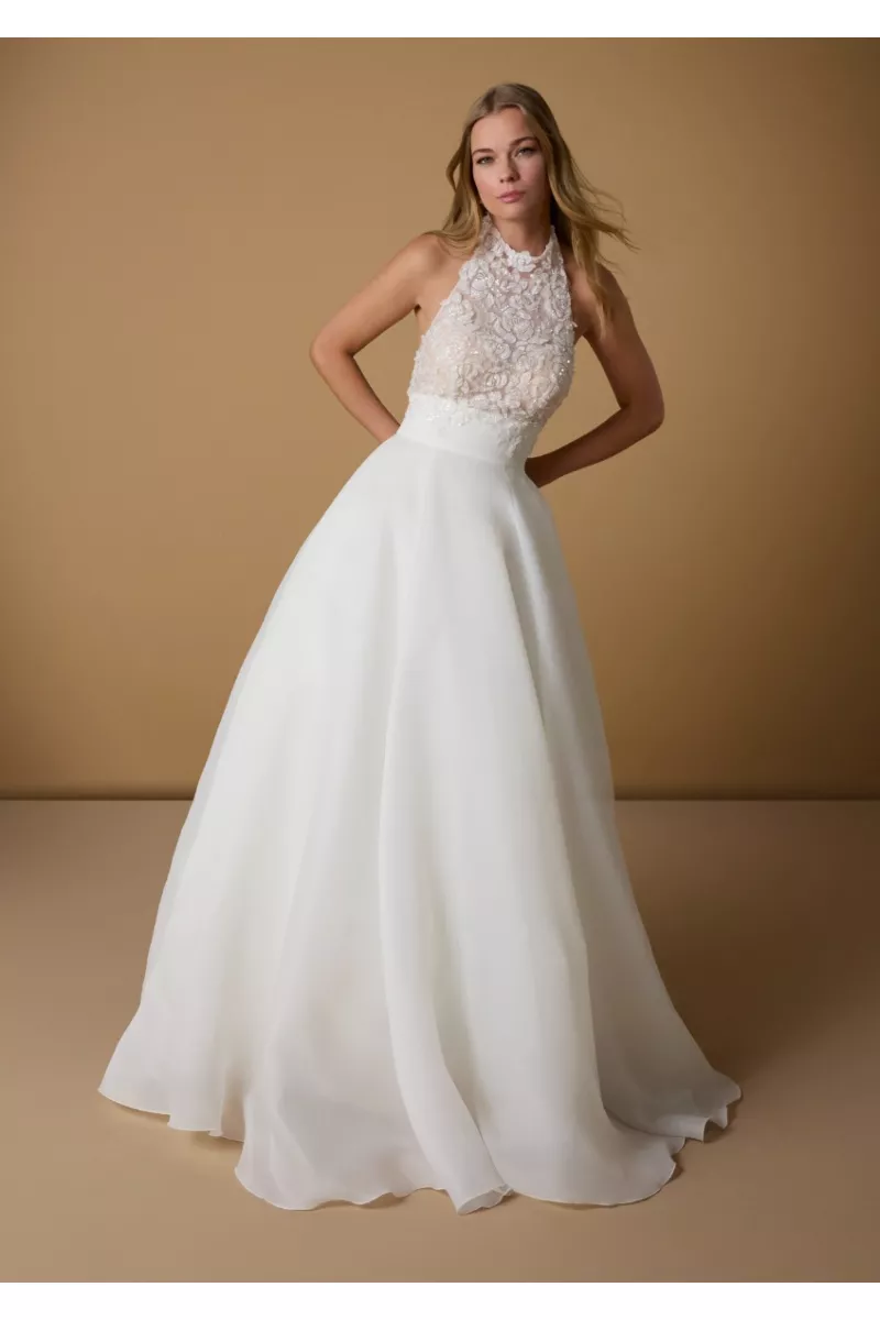 Abito da sposa ABIA con corpino in pizzo floreale e gonna ampia in tulle bianco.
