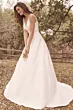 Abito da sposa Paxton di Maggie Sottero in un giardino, stile elegante e semplice, con scollo a V e gonna ampia.