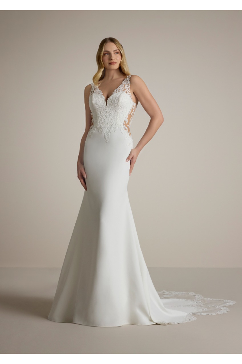 Abito da sposa DREMA in pizzo e seta, scollatura a cuore, modello sirena, dettagli trasparenti.