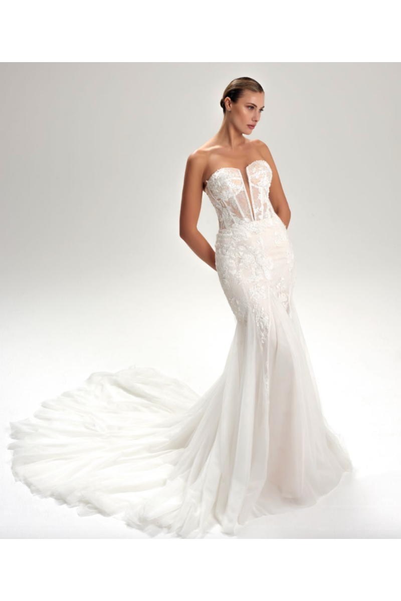 Abito da sposa Lapislazzuli, modello Capri, con corpetto trasparente e strascico lungo, elegante e raffinato.