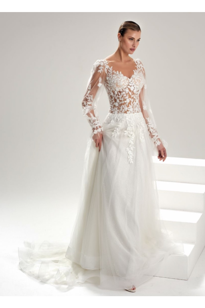 Abito da sposa in pizzo trasparente con dettagli floreali, modello CRISTALLO di SPOSA CAPRI.