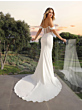 Abito da sposa AREANNA Ladybird, schiena scoperta, tramonto sullo sfondo, eleganza e stile raffinato.
