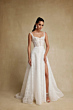 Abito da sposa Belinda Rara Avis in pizzo bianco con corpetto trasparente e spacco laterale.